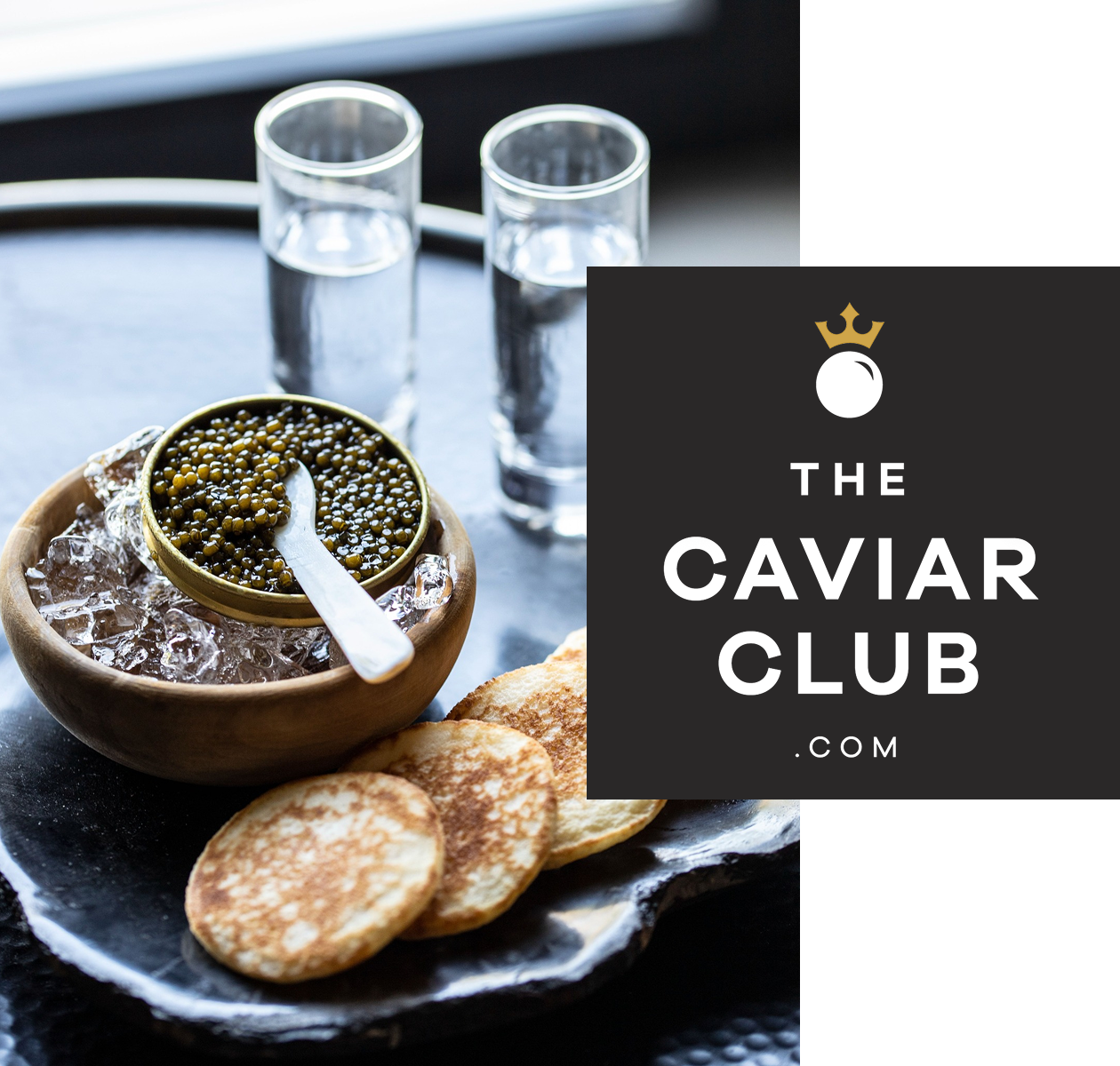 Caviar dish with crackers and glasses