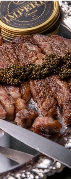 Plated dish of cooked meat with caviar